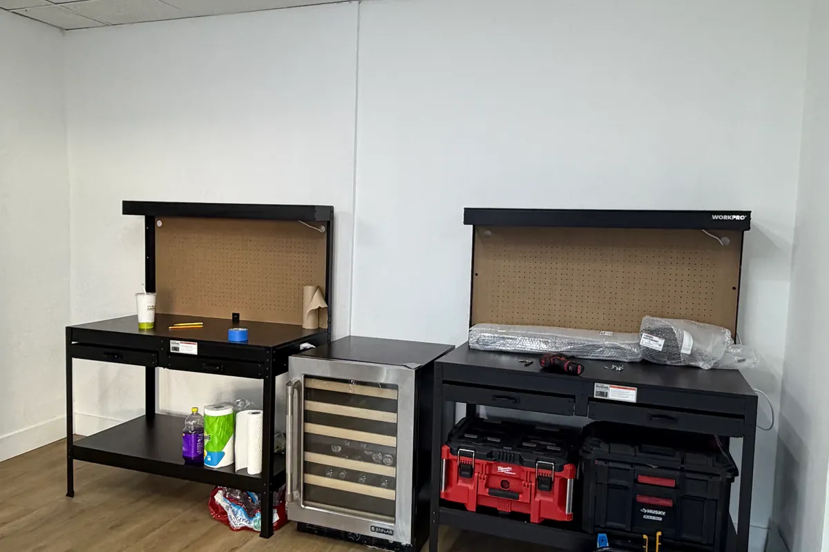 ApexPro training bay with two workbenches, a wine cooler unit and stacked tool cases