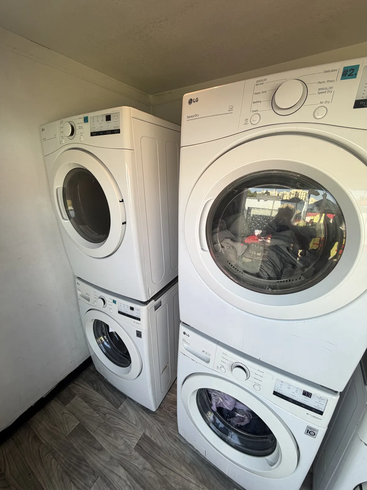 Stacked washer and dryer in a Los Angeles laundry closet serviced by ApexPro
